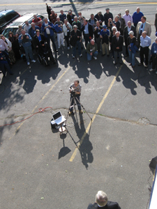 The crowd of members watched...